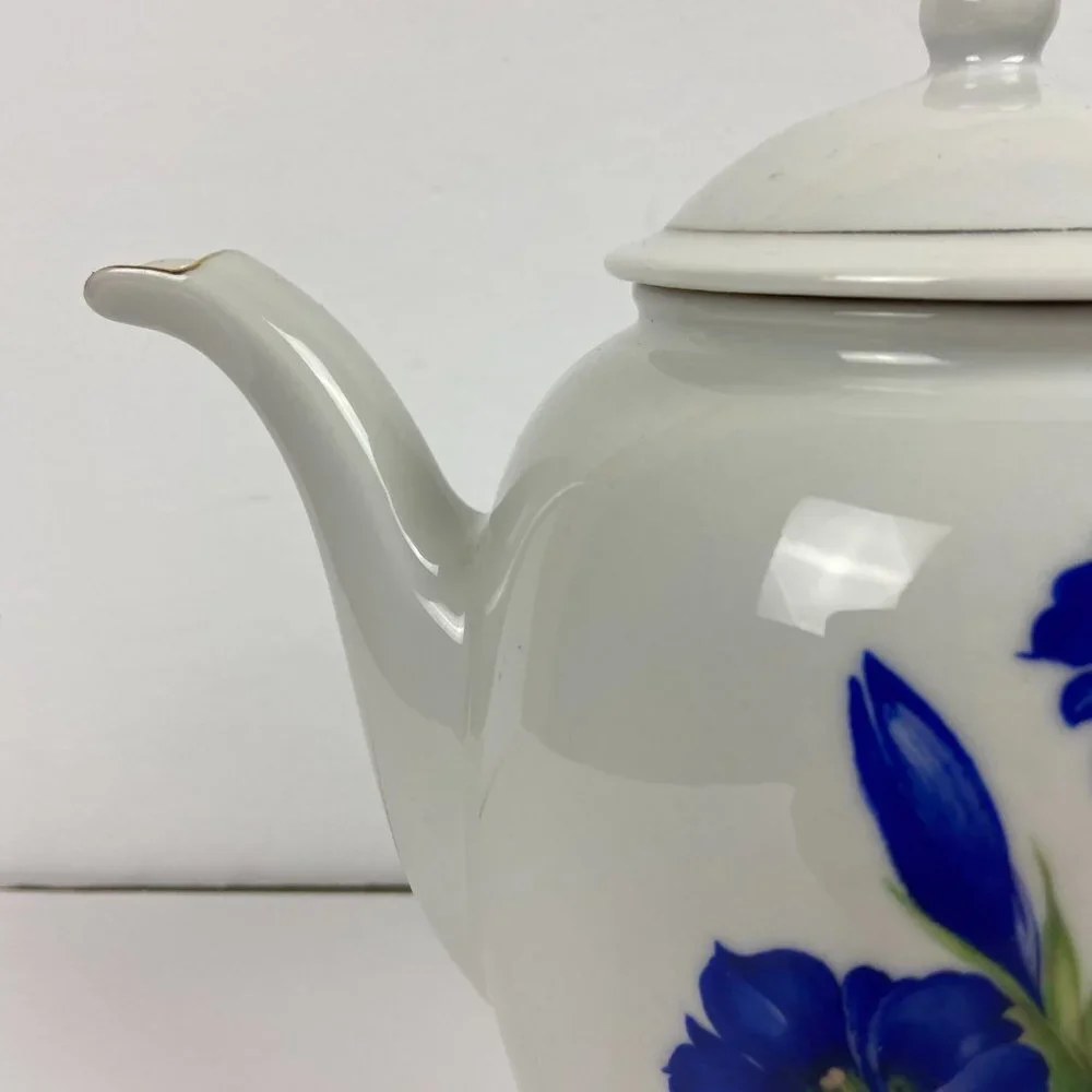 Vintage porcelain large tea pot with the floral decor
